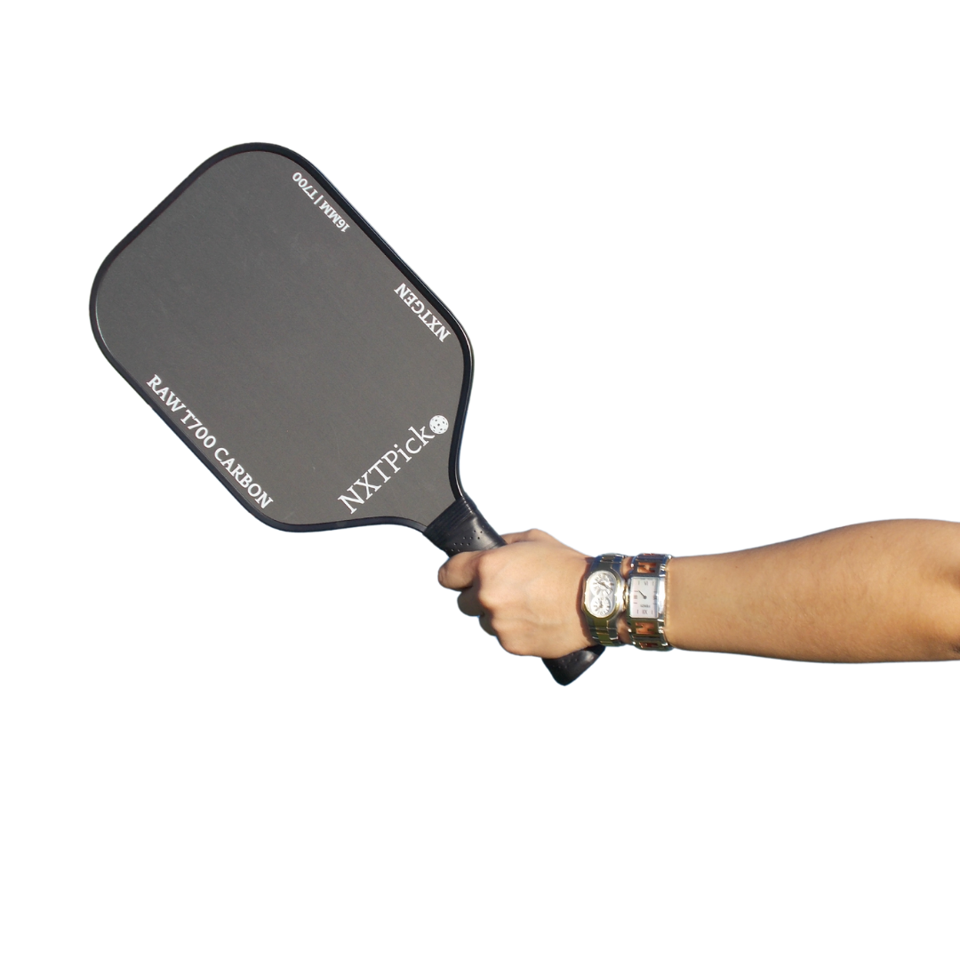 Hand holding the NXTPick NXTGen paddle made with raw T700 carbon fiber – black pickleball paddle